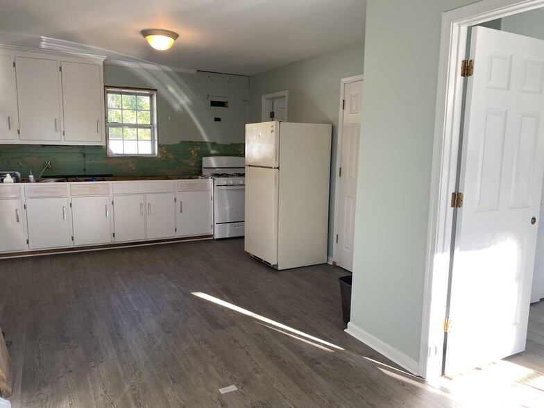Kitchen - door to laundry and door full bathroom - 208 Meade Ave