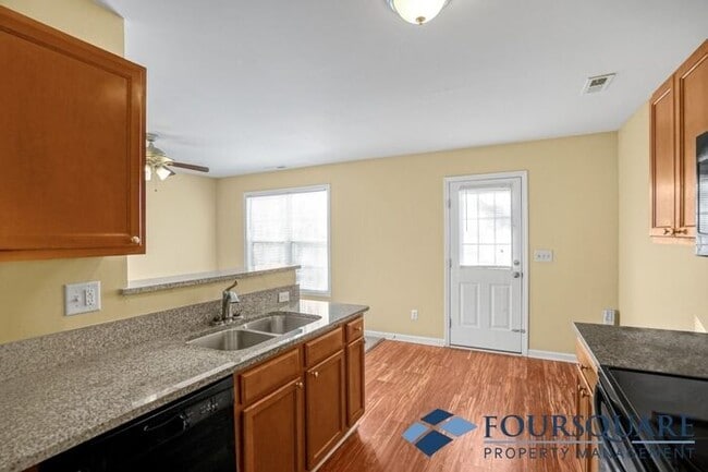 Building Photo - Charming 3-Bedroom Townhome with First-Floor Suite & Off-Street Parking – Near Capital Blvd & I-440