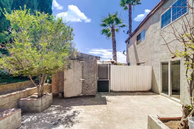 Let your furry friends get some outdoor fun in this gated backyard - 2304 E 14th St