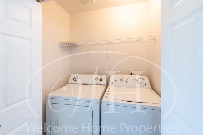Building Photo - Enjoy the Open Floor Plan and Generous Sto...