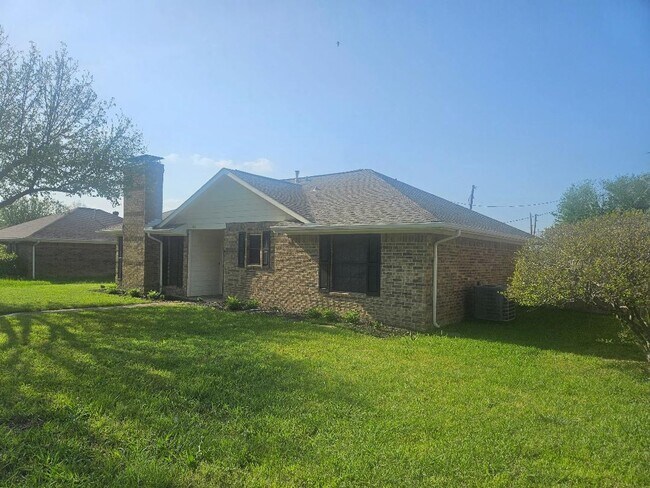 Building Photo - Three bedroom and two bathroom nicely remodeled with new flooring. Large wood fenced backyard