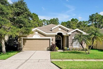 Building Photo - "Stunning Fully Furnished 3BR Orlando Home with Private Screened Pool, Spa & Spacious Living Areas"
