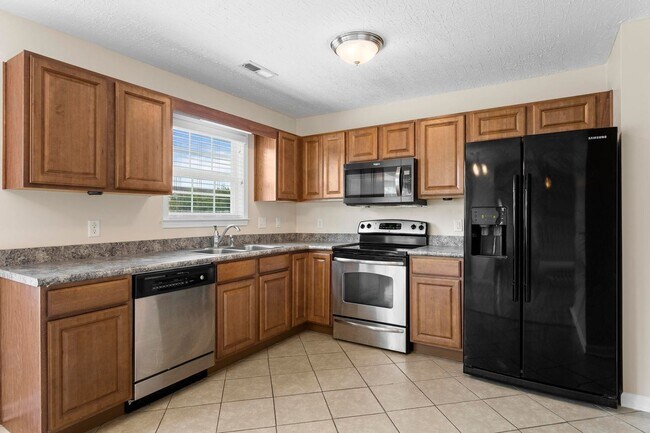 Building Photo - House with Fenced Back Yard Available!