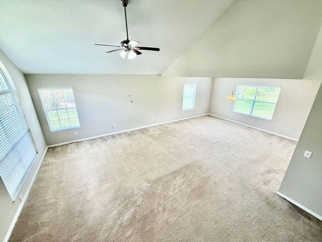 Building Photo - LARGE AND SPACIOUS 4/3 HOME IN EAST ORLANDO WEDGEFIED COMMUNITY