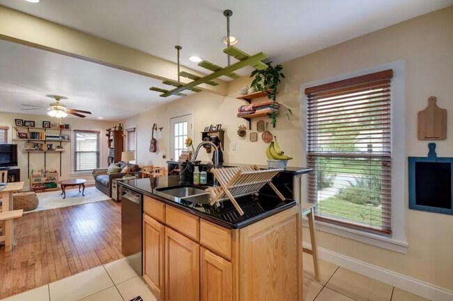 Building Photo - Discover Your Austin Oasis: Revitalized Bungalow with Hardwood Floors and Entertainer's Deck!