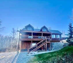 Building Photo - Amazing custom built Alaskan Log home across from Rainbow Lake!  Fully Furnished!