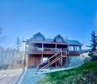 Building Photo - Amazing custom built Alaskan Log home across from Rainbow Lake!  Fully Furnished!