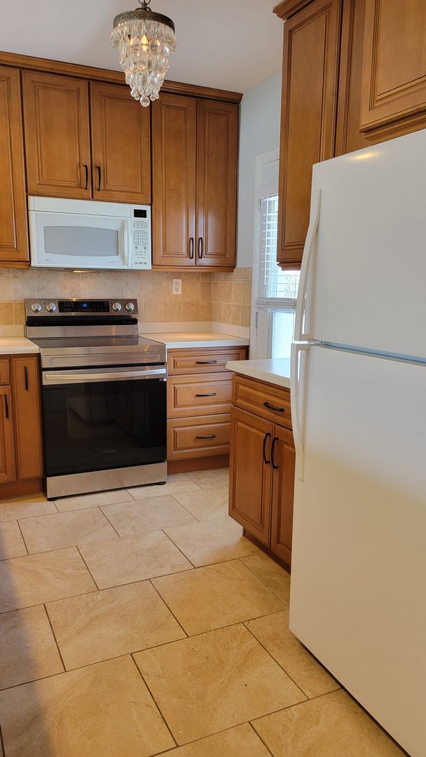 Building Photo - BACK ON THE MARKET-Annual UNfurnished top ...