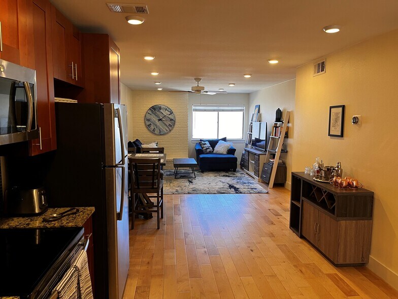 Living room, as viewed from the kitchen. - 909 Reinli St