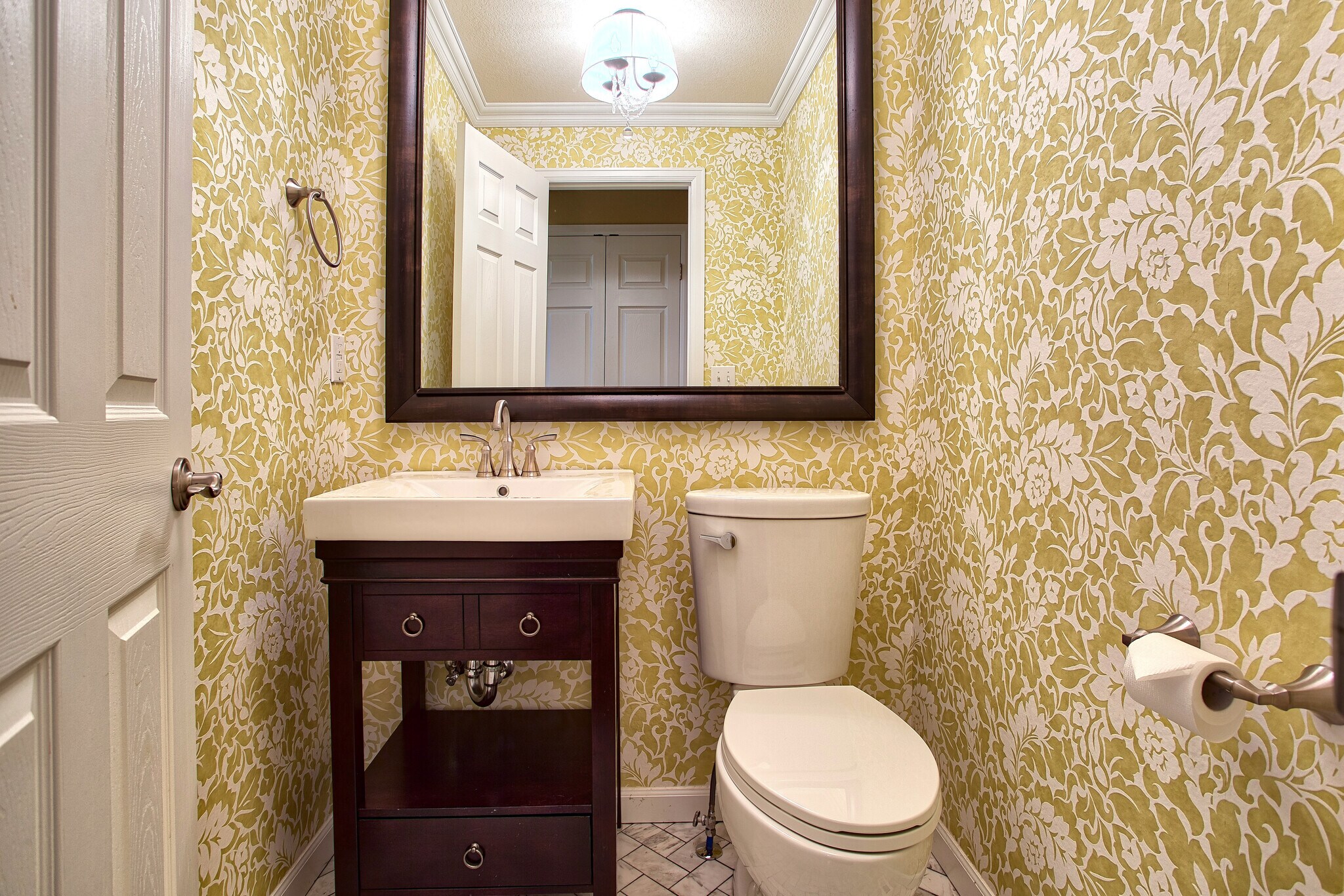 Main floor powder room with herringbone marble floor tile and decorator wallpaper - 7422 E 7th Ave Unit 14