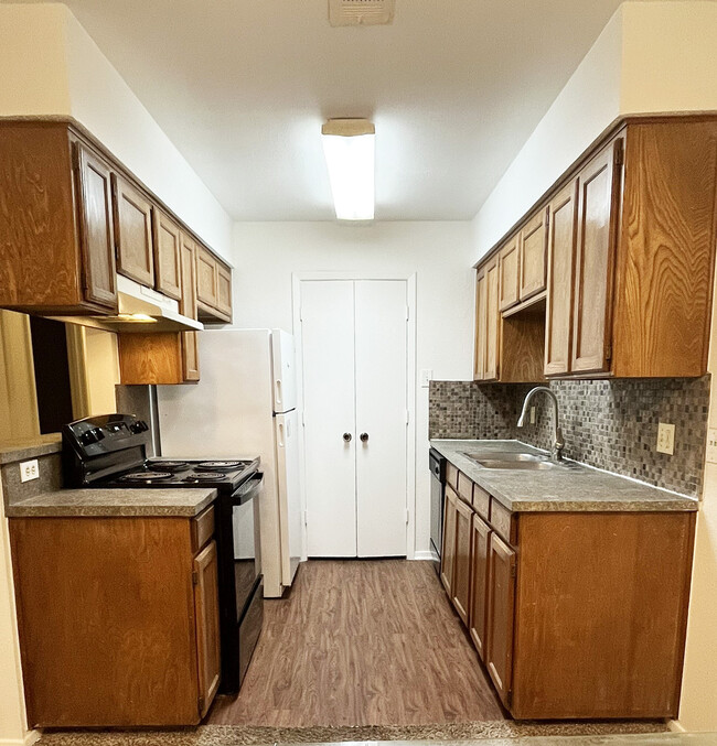 This is a well-equipped kitchen with plenty of amenities includes laundry ready hook up near kitchen - 4917 Jamesway Rd