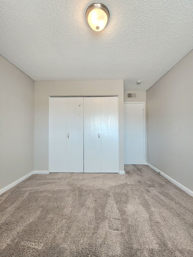 Building Photo - 4 Bedroom Two-Story Home with Downstairs Primary Bedroom & Fireplace