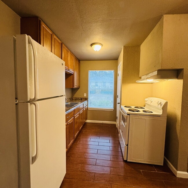 Building Photo - Welcome to Pine Shadows Duplex Apartment