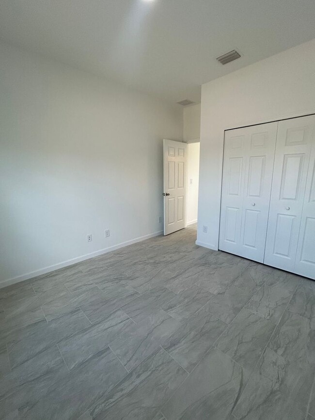 Building Photo - JUST BUILT! Spacious 4/2/2 Home -Perfect for Your Family in SW Lehigh Acres