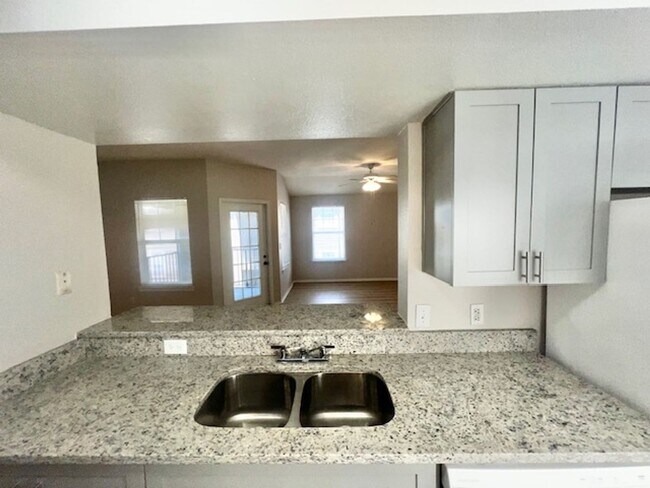 Building Photo - NEW-Remodeled bathroom & kitchen! NEW VINYL PLANK flooring & fresh paint! 2 bedroom 1 bath condo ...