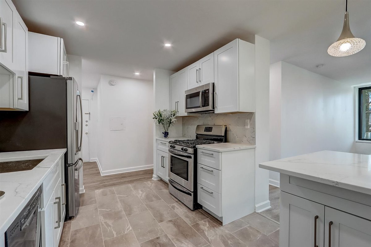 Gorgeous remodeled kitchen open to entryway and to living room. - 240 M St SW