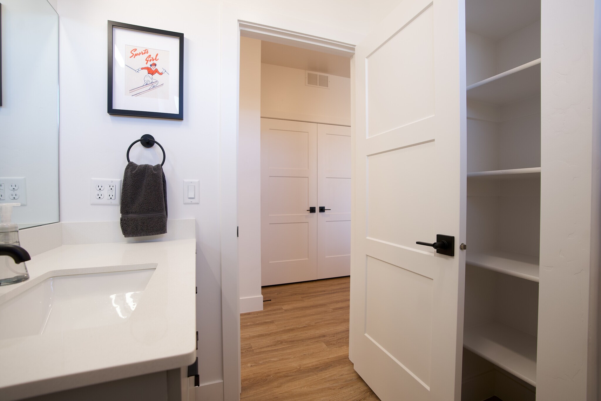 Hallway bathroom with linen shelves - 525 N 1st St