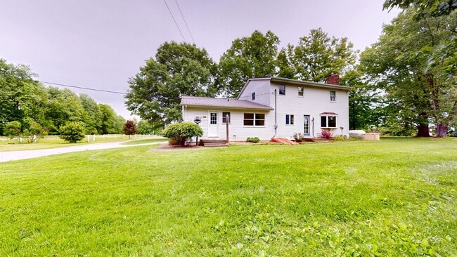Building Photo - County living with pond & out buildings