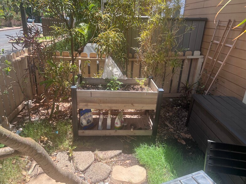Raised potting bed with fresh herbs - 140 Uwapo Rd