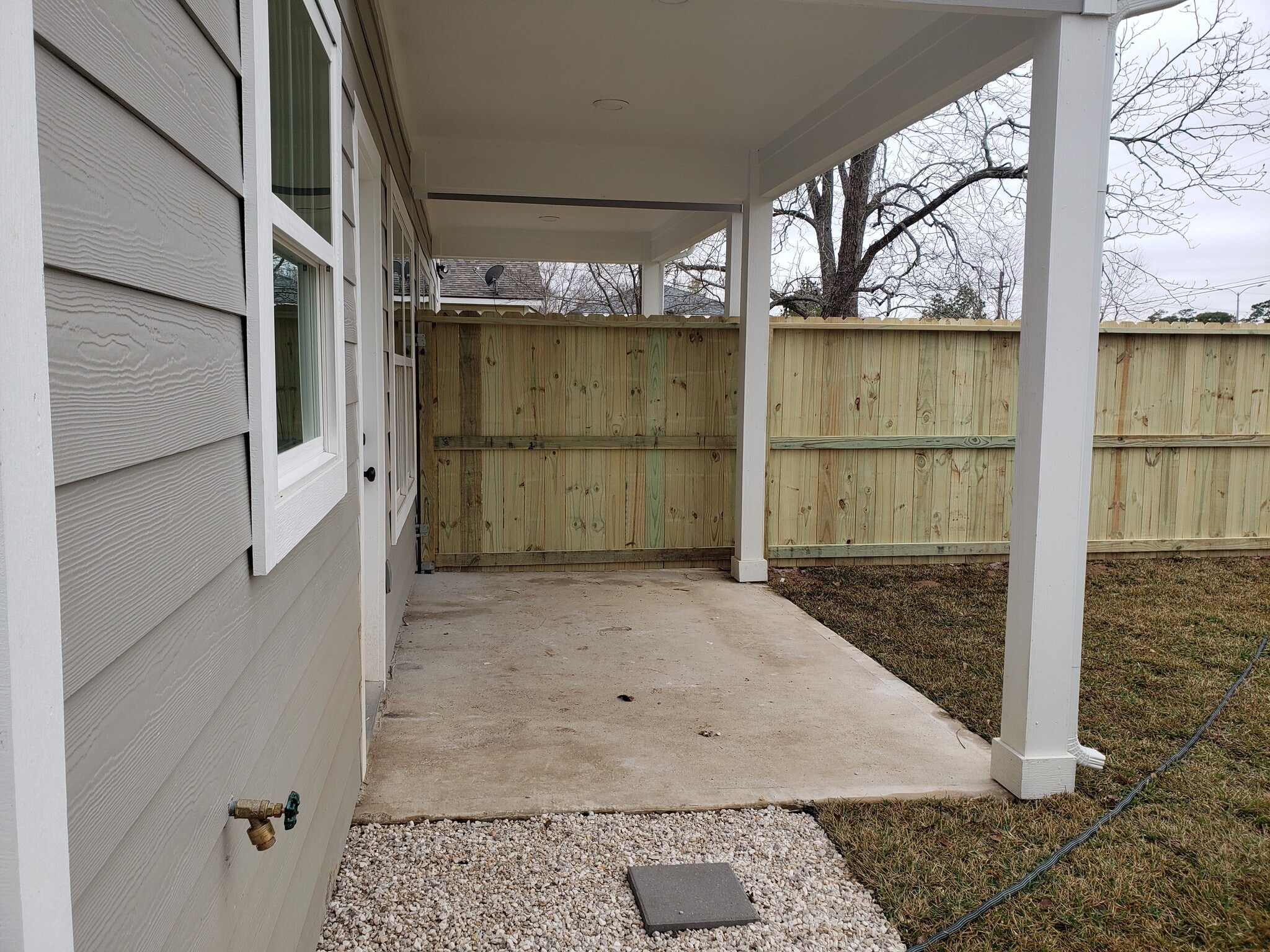 Private, covered back patio - 928 W Austin St