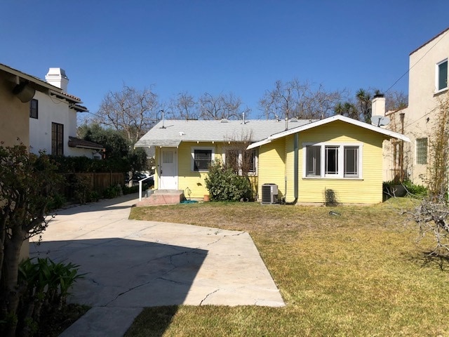 View of main BR, den, kitchen from backyard. - 10516 Blythe Ave