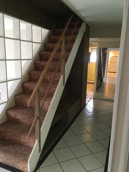 Stairs leading to plenty of attic storage space - 35 Red Berry Rd