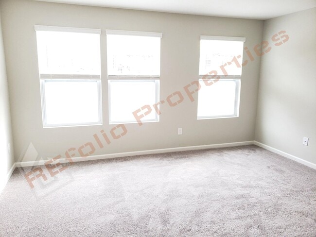 Building Photo - Beautiful Luxury 3 Story 3 Bedroom Townhome with 1st Floor Guest Suite, Attached 2 Car Garage, Co...