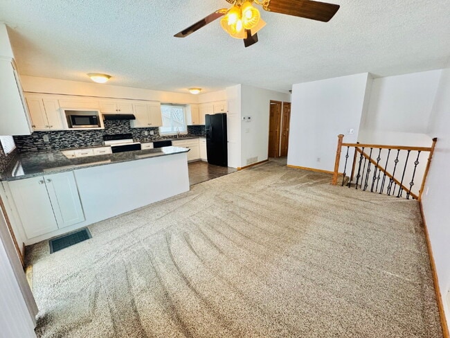 Building Photo - Single Family Home with 4-Bedrooms and 2 bathrooms in Coon Rapids