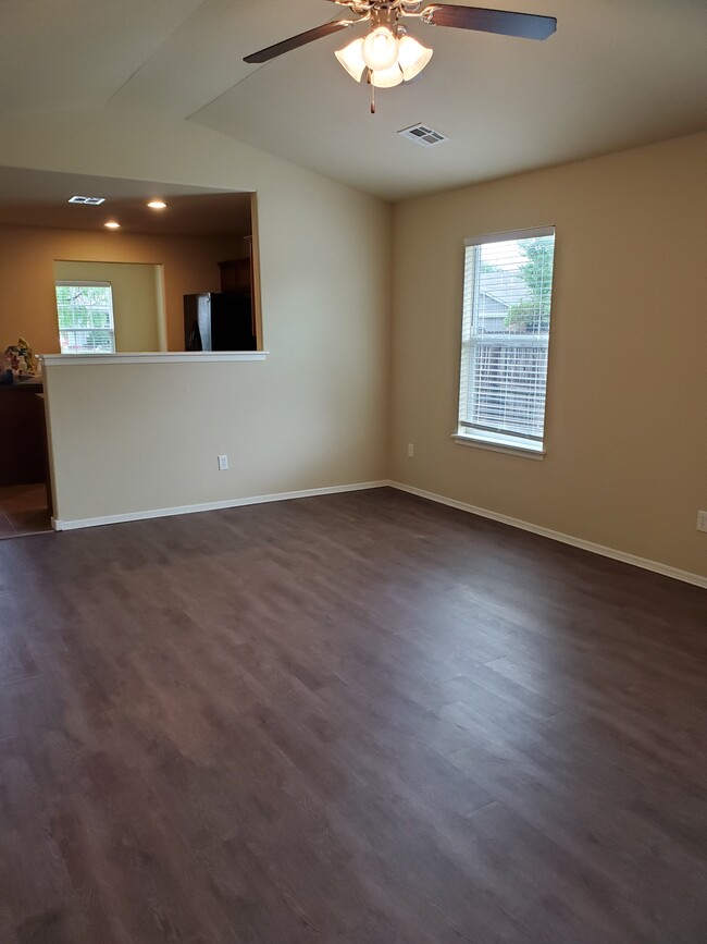 Living room seen from back door, view into kitchen - 16021 S 83rd East Ave