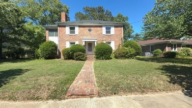 Building Photo - Charming 2BR with Sunroom, Hardwood Floors & Lawn Care Included
