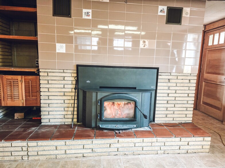Downstairs fireplace - 1008 W Singing Woods Rd