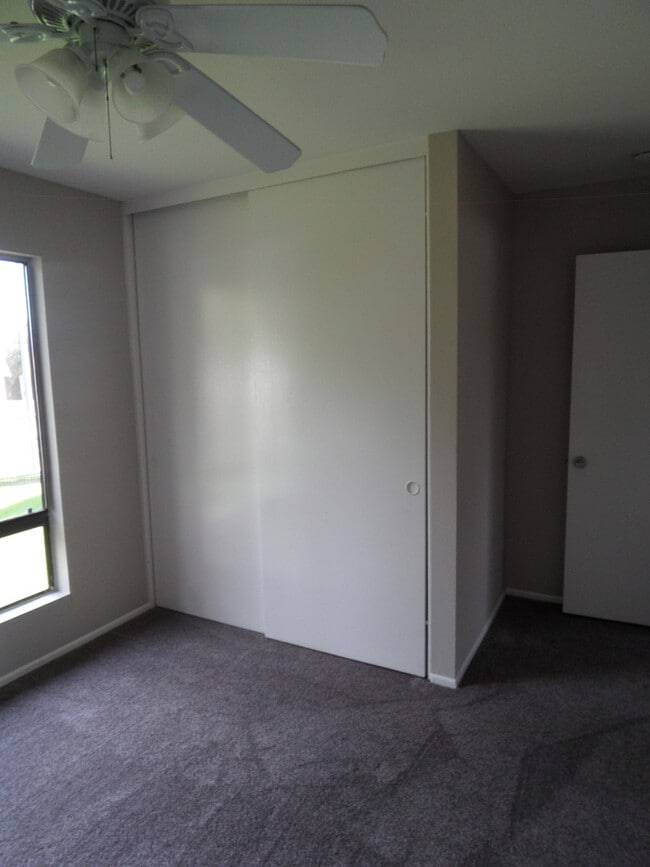 Building Photo - Two Story 4 BR 2.5 BA Condo With 2 Car Garage