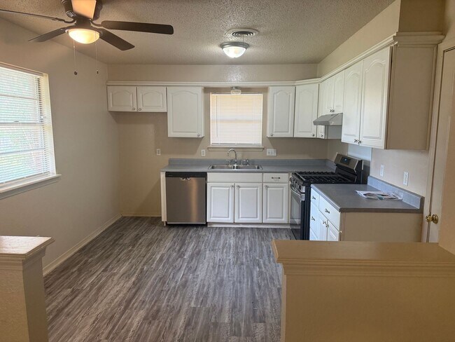 Building Photo - New paint and appliances, luxury vinyl plank and a fenced yard, these 3 beds 1.5 bath is ready fo...
