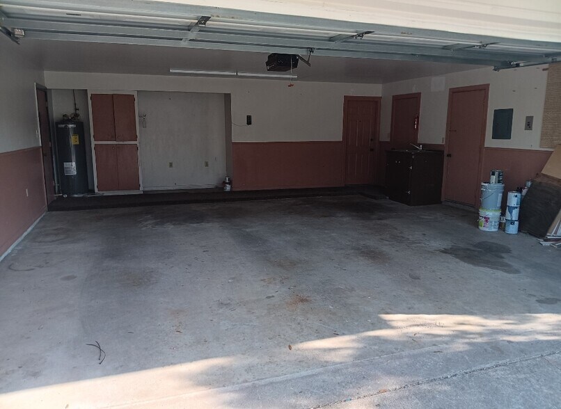 double with utility sink, closet, door to back yard, and storage cabinet - 2308 Wesley Cir