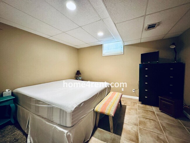 Building Photo - A Lovely, Four Bedroom Lenexa Home w/ Wood...