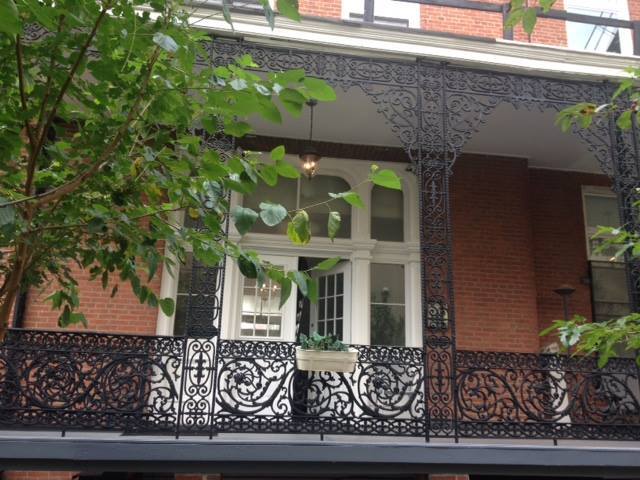 Historic balcony framed by original ironwork - 1901 E Lombard St