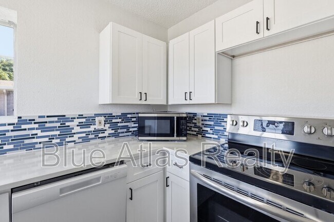 Building Photo - 7124 Wagonwheel Rd