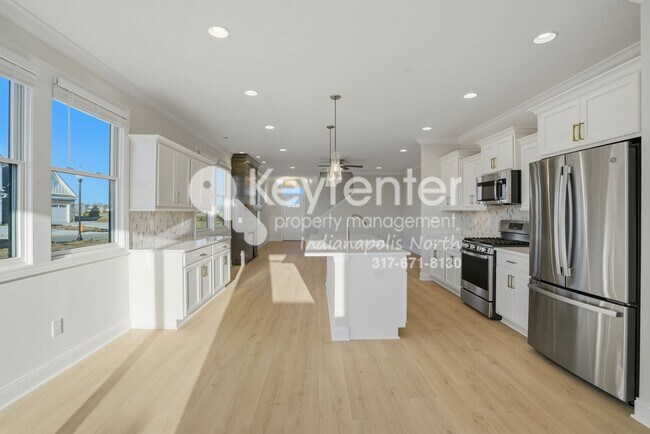 Building Photo - Located in Westfield, IN, this attractive 3-bedroom, 2.5-bath home sits on a corner lot within an...