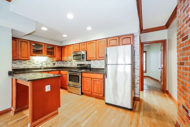 Building Photo - Charming 1-Bedroom Apartment with Exposed Brick, Hardwood Floors & Updated Kitchen