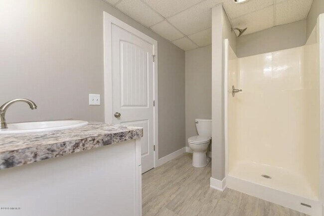 Building Photo - Spacious 3BR Duplex with Finished Basement & 2-Car Garage in Otsego