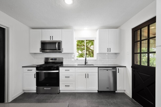 Building Photo - READY FOR MOVE IN! FULLY REMODELED 3-BEDRO...