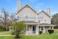 Building Photo - Inviting 2-Bed Townhome with Front Porch, Private Parking  & Storage