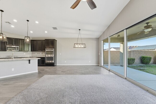 Building Photo - Stunning 4-Bed + Den Eastmark Home with Modern Upgrades Throughout