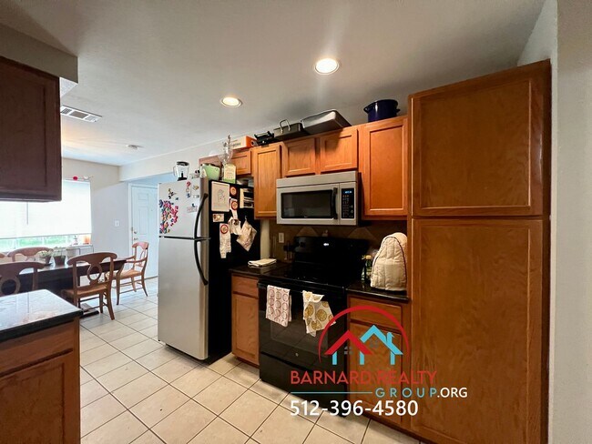 Building Photo - Available July 18: 3 bedroom, 2.5 Bath Duplex with Garage and Fenced Yard