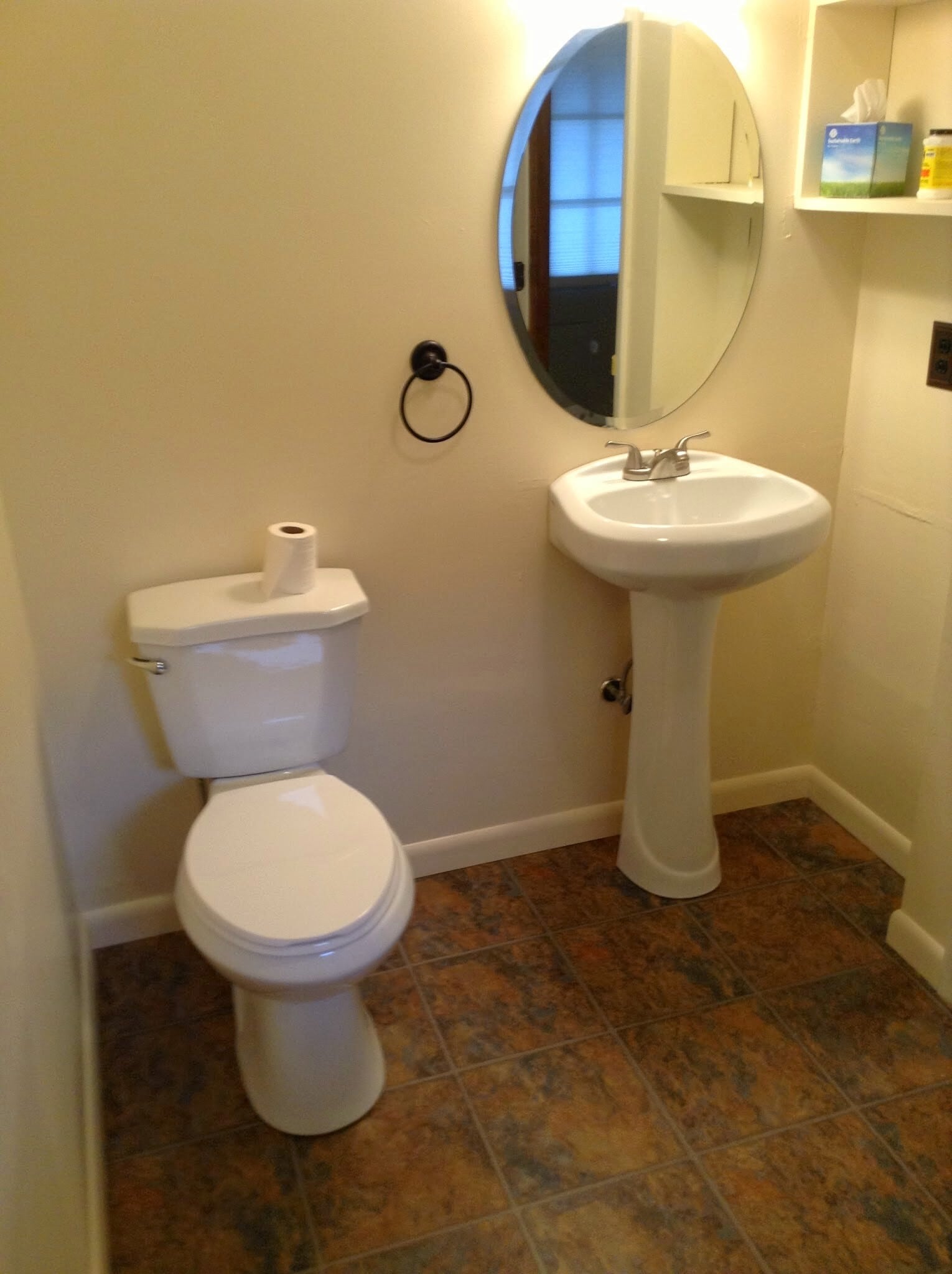 downstairs half bath and laundry - 38 Whispering Pines Rd