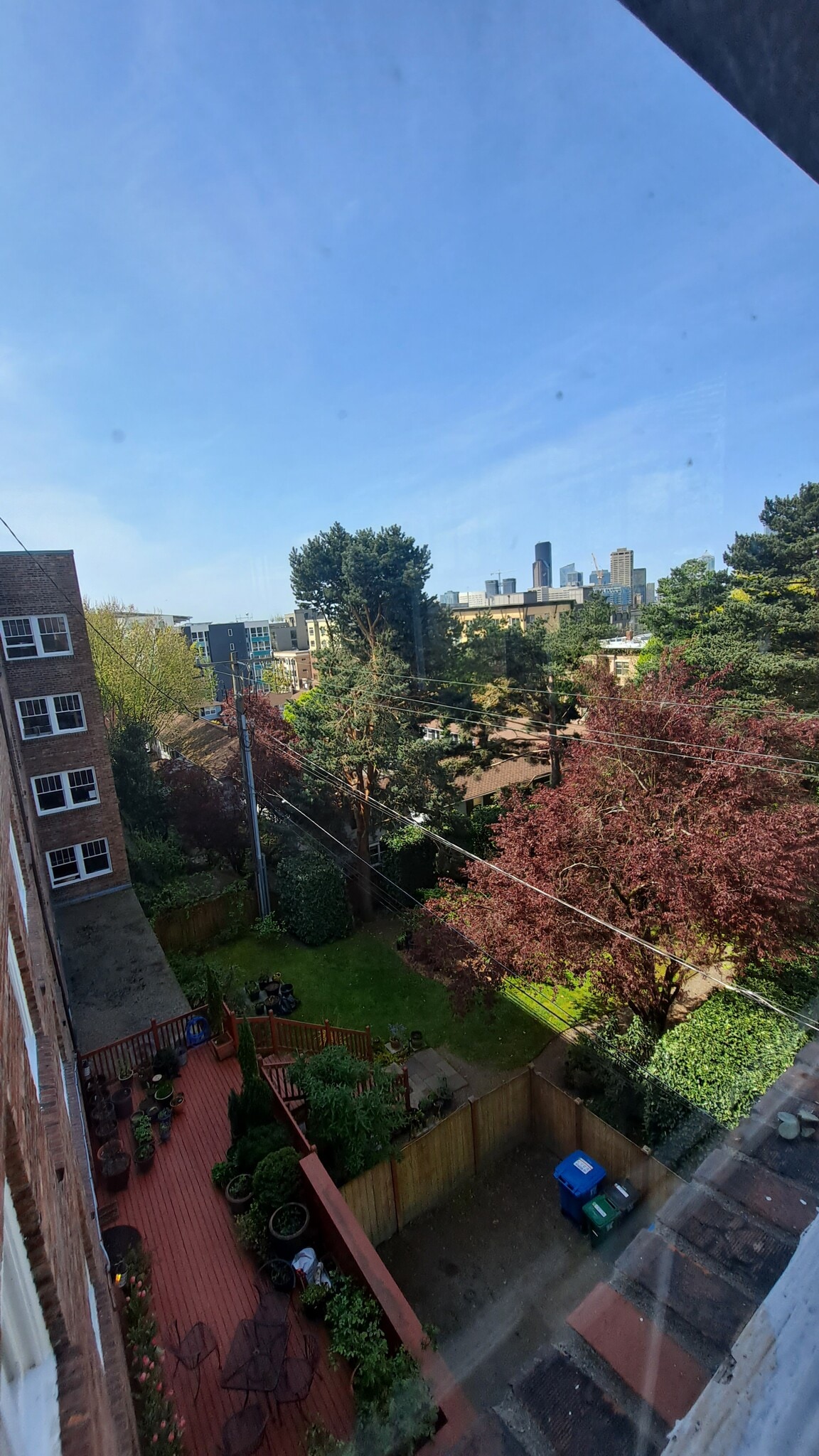 Building's fenced yard, deck and picnic area view from unit - 1631 16th Ave