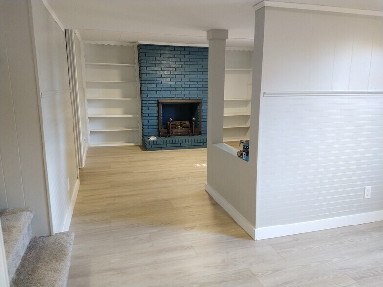 Family room with laundry and extra storage room - 6457 Peacock Blvd