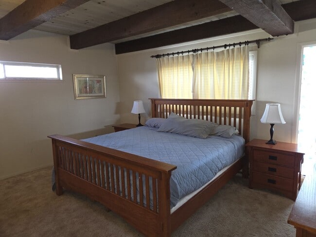 Building Photo - Unique open design,wood beams in all rooms-Very cheery and cozy. Newly remodeled, and newly furni...