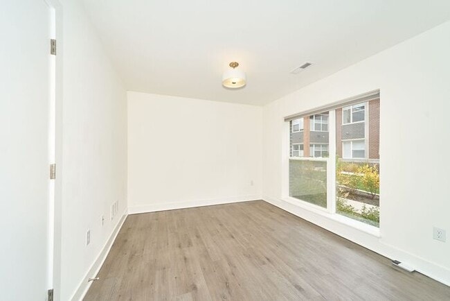 Building Photo - Like New Townhome With Your Own Rooftop Views of Downtown Indy!