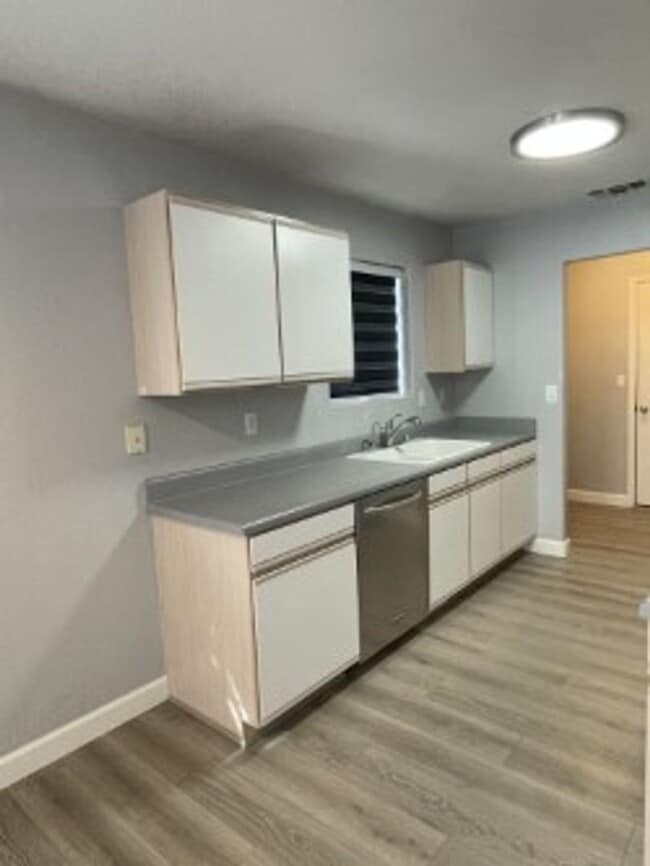 Building Photo - North side home, pet friendly with fenced back yard.